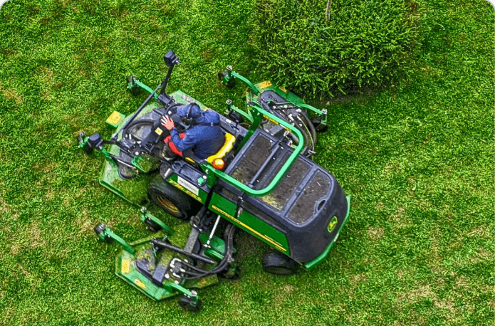 Riding mower on a freshly cut lawn