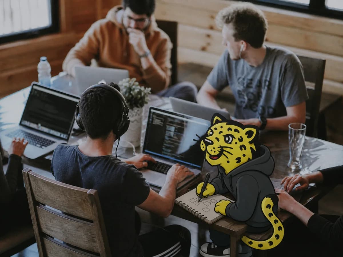 Startup team collaborating while Leo sketches in a notebook